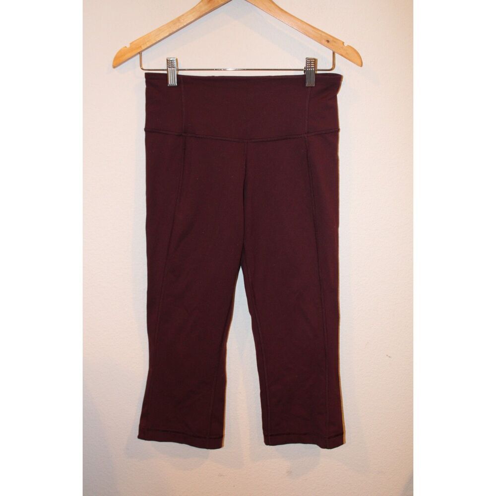 Lululemon burgundy low rise capri leggings with split hem size 6